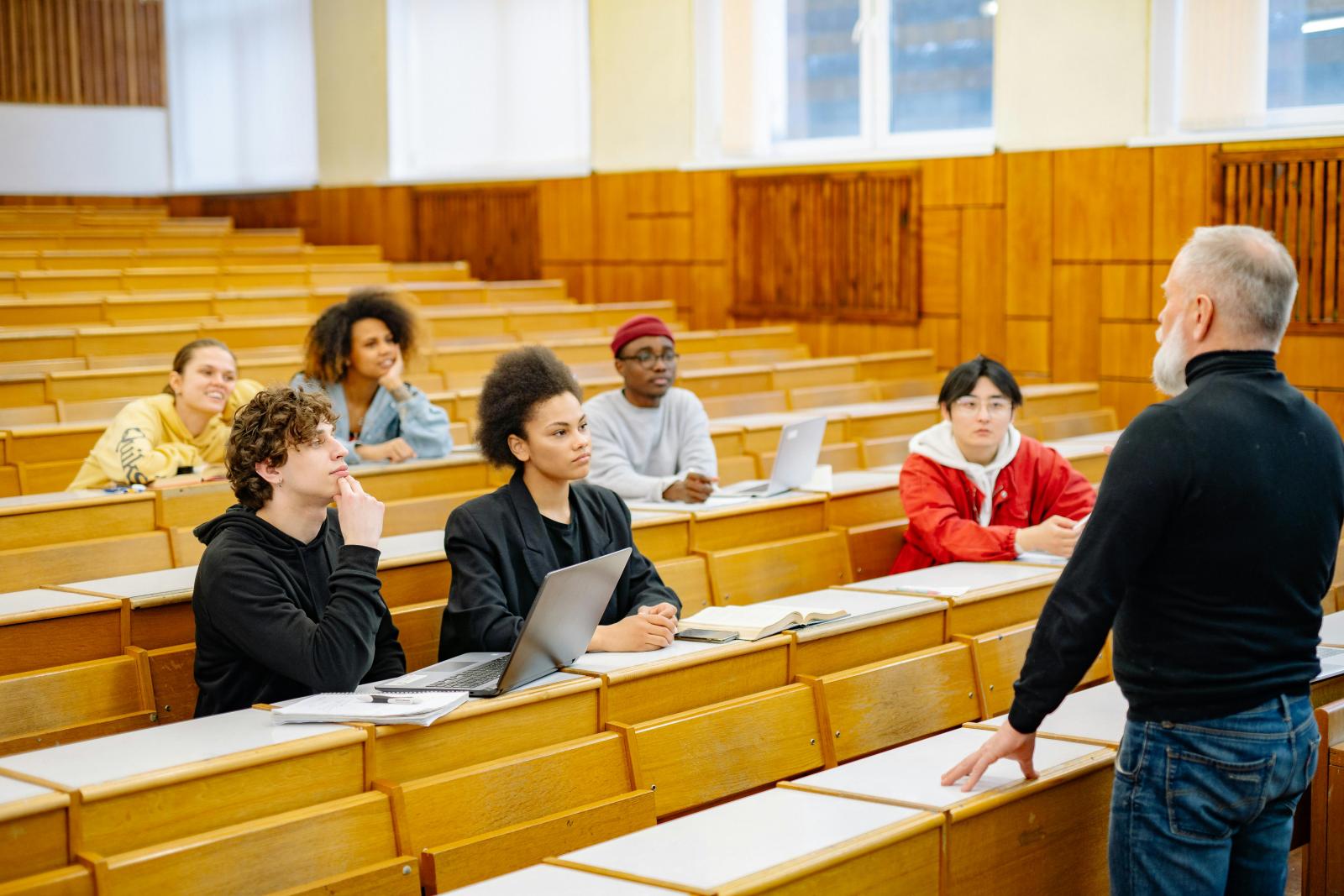 Photo by Yan Krukau: https://www.pexels.com/photo/professor-standing-in-front-of-his-students-8197551/